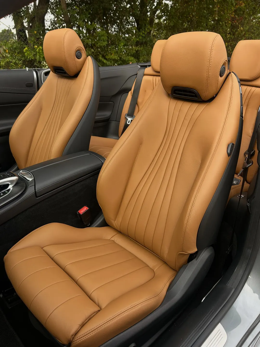 Tan leather front seats re-trimmed by DK Schweizer in a convertible, roof down