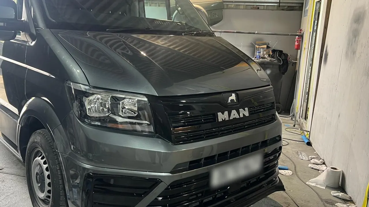 The same MAN van in the shop, white as it came in and grey as it went out, after