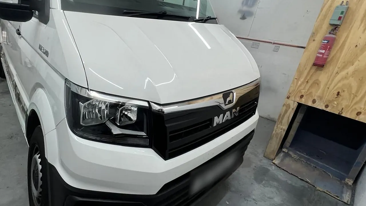 The same MAN van in the shop, white as it came in and grey as it went out, before
